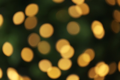 Photo of Abstract background with blurred yellow Christmas lights, bokeh effect