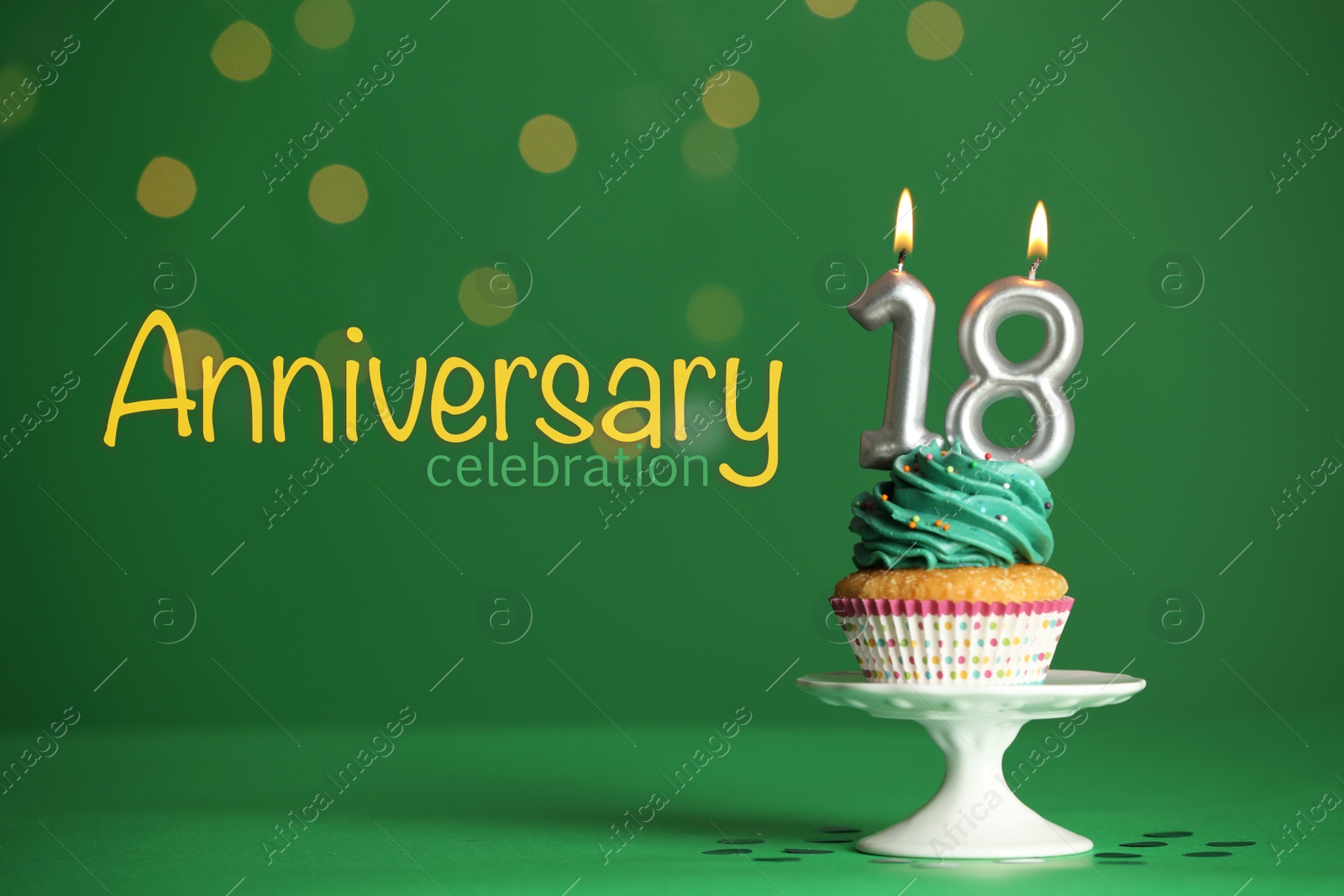 Image of Coming of age party - 18th birthday. Delicious cupcake with number shaped candles on green background. Anniversary celebration