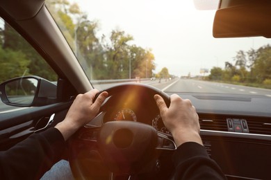 Man driving his car, closeup. Traffic rules