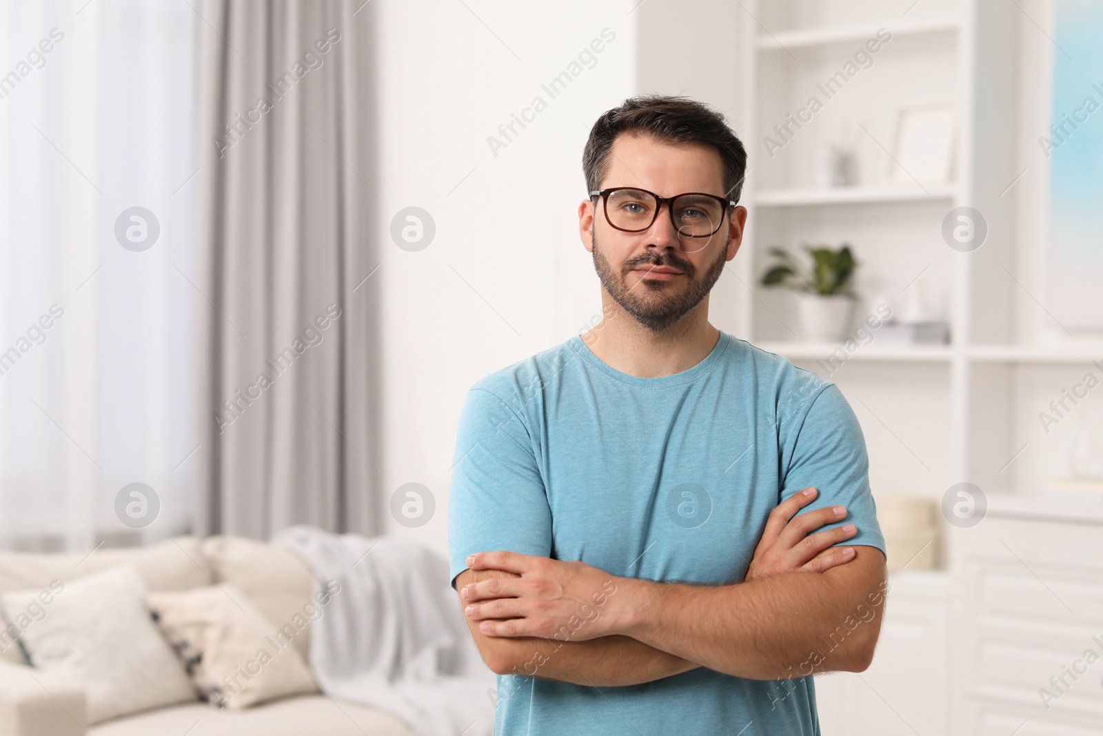 Photo of Portrait of man in stylish glasses at home