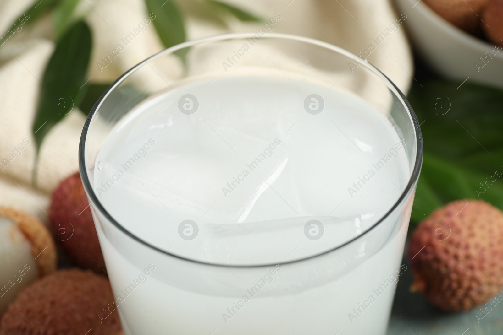 Photo of Freshly made lychee juice on table, closeup