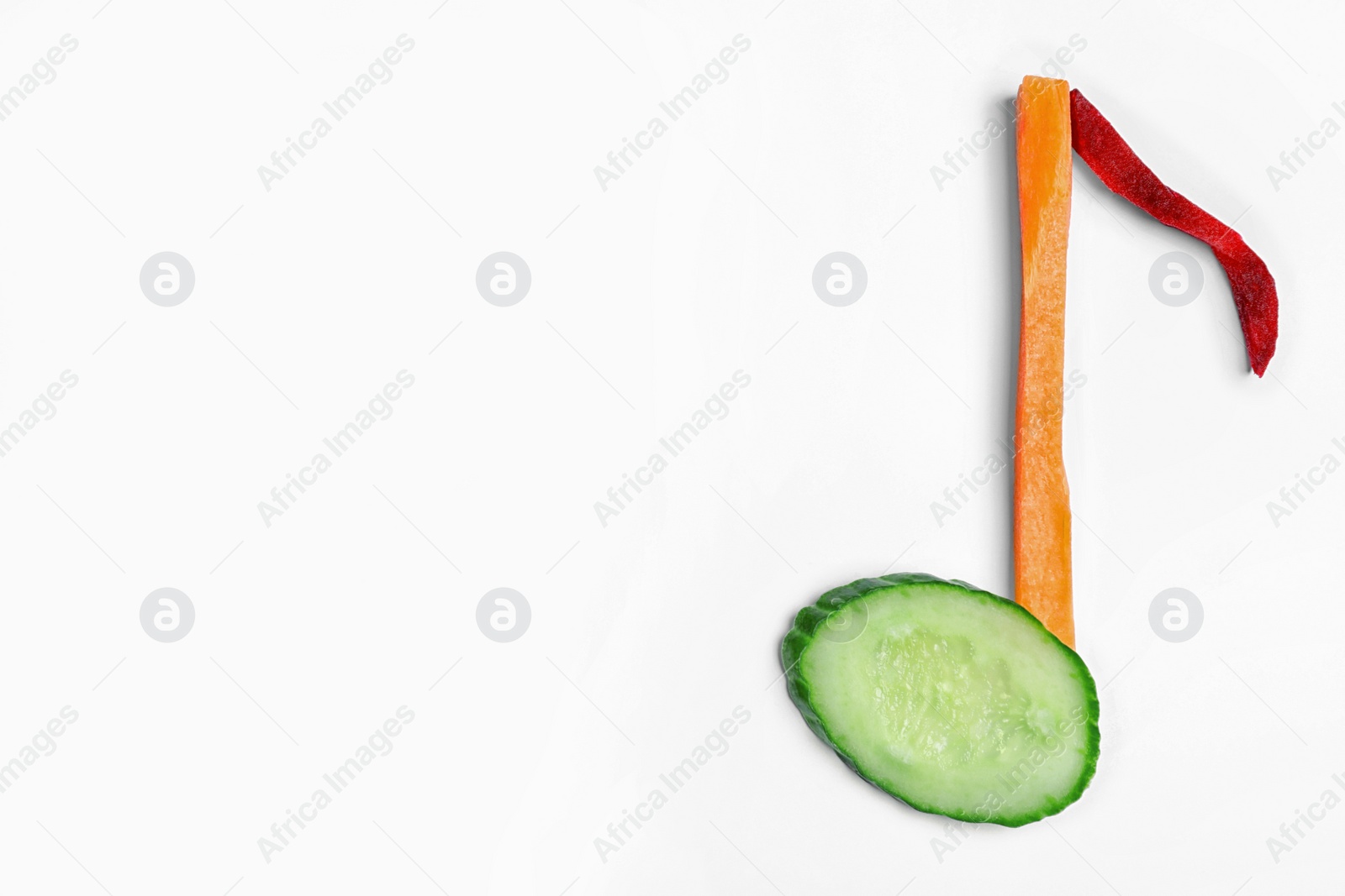 Photo of Musical note made of vegetables on white background, top view