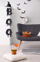 Stylish room interior with creative Halloween decor