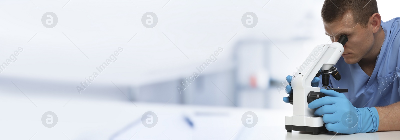Image of Laboratory assistant using microscope indoors, space for text. Health care worker