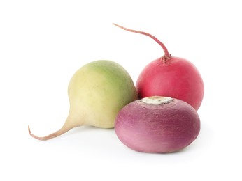 Different fresh ripe turnips on white background