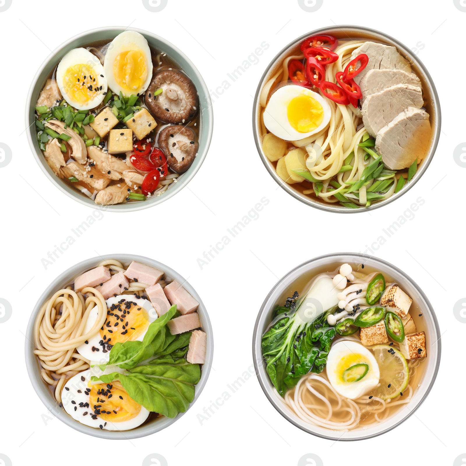 Image of Set with bowls of delicious ramen with different ingredients isolated on white, top view. Noodle soup