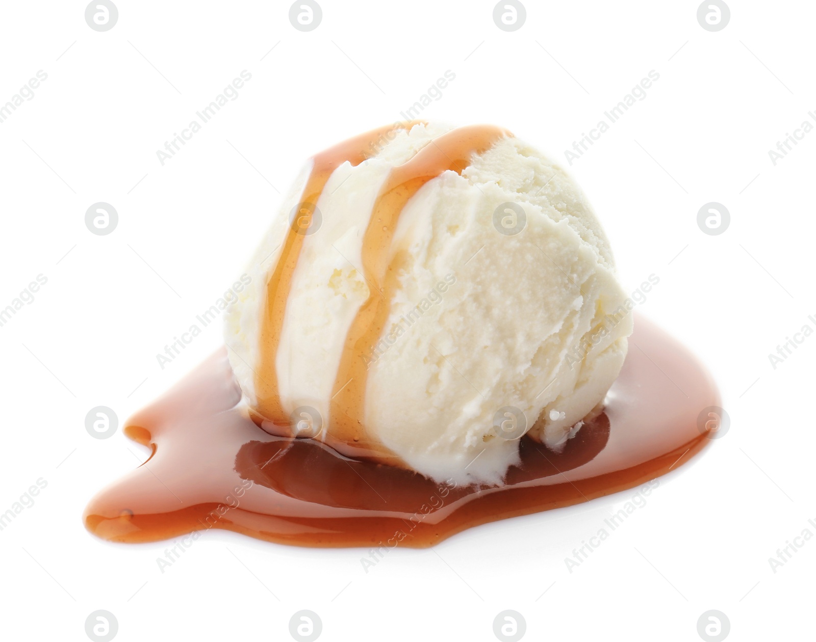 Photo of Ball of tasty vanilla ice cream with caramel topping on white background