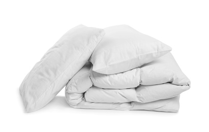 Photo of Clean blanket and pillows on white background