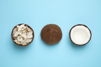 Photo of Flat lay composition with tasty coconut chips on light blue background