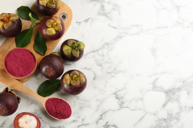 Purple mangosteen powder and fruits on white marble table, flat lay. Space for text