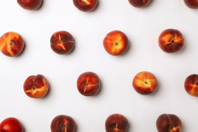 Flat lay composition with sweet juicy peaches on light background