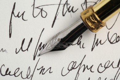 Photo of One fountain pen on handwritten letter, closeup