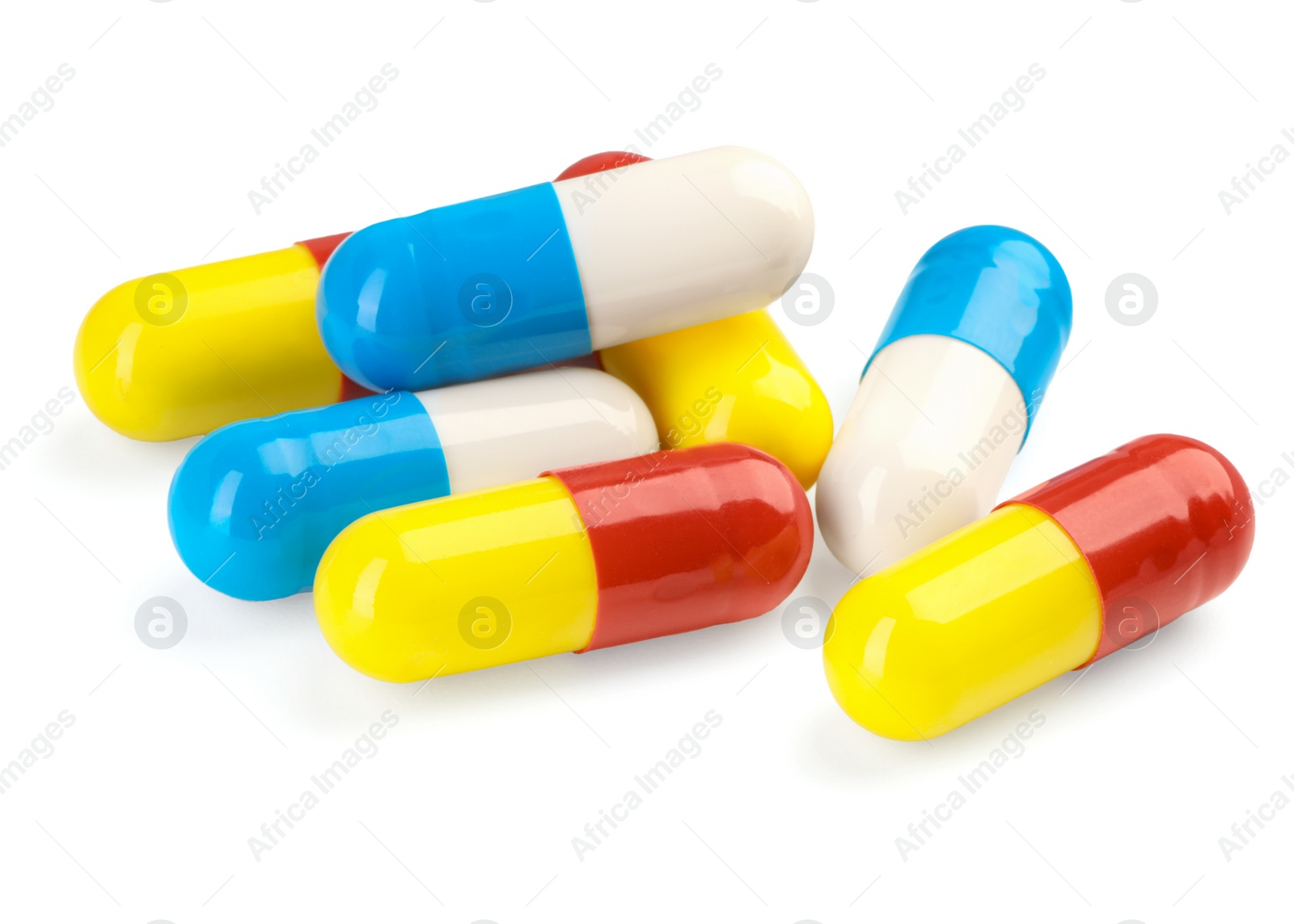 Photo of Many antibiotic pills isolated on white. Medicinal treatment