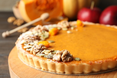 Delicious fresh homemade pumpkin pie on wooden table, closeup