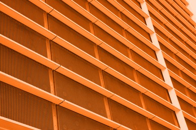 Modern building, low angle view. Toned in orange color