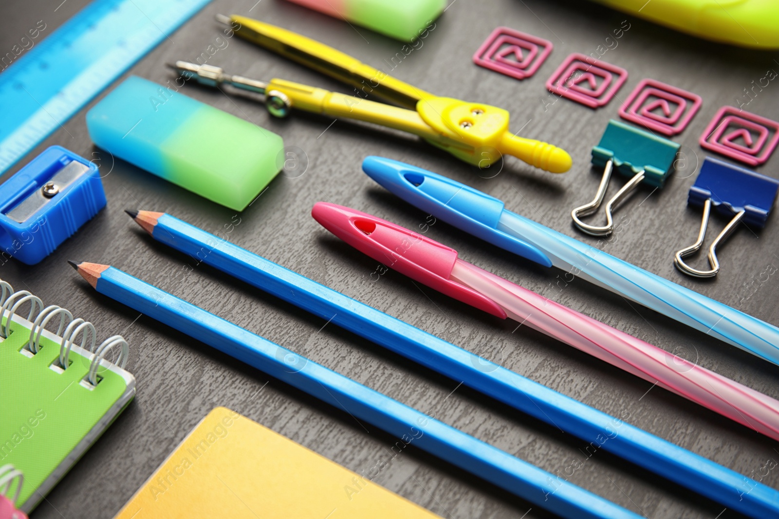 Photo of Different stationery on wooden table. Back to school