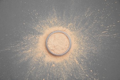 Photo of Loose face powder on grey background, flat lay