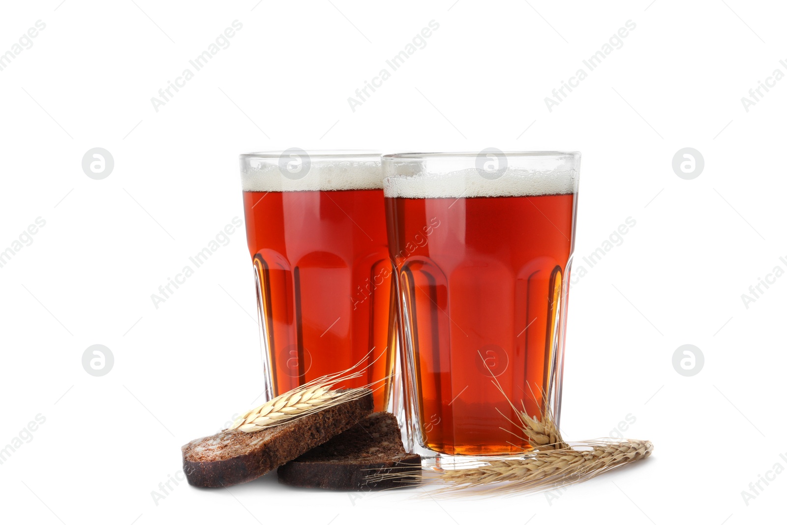 Photo of Delicious kvass, bread and spikes on white background
