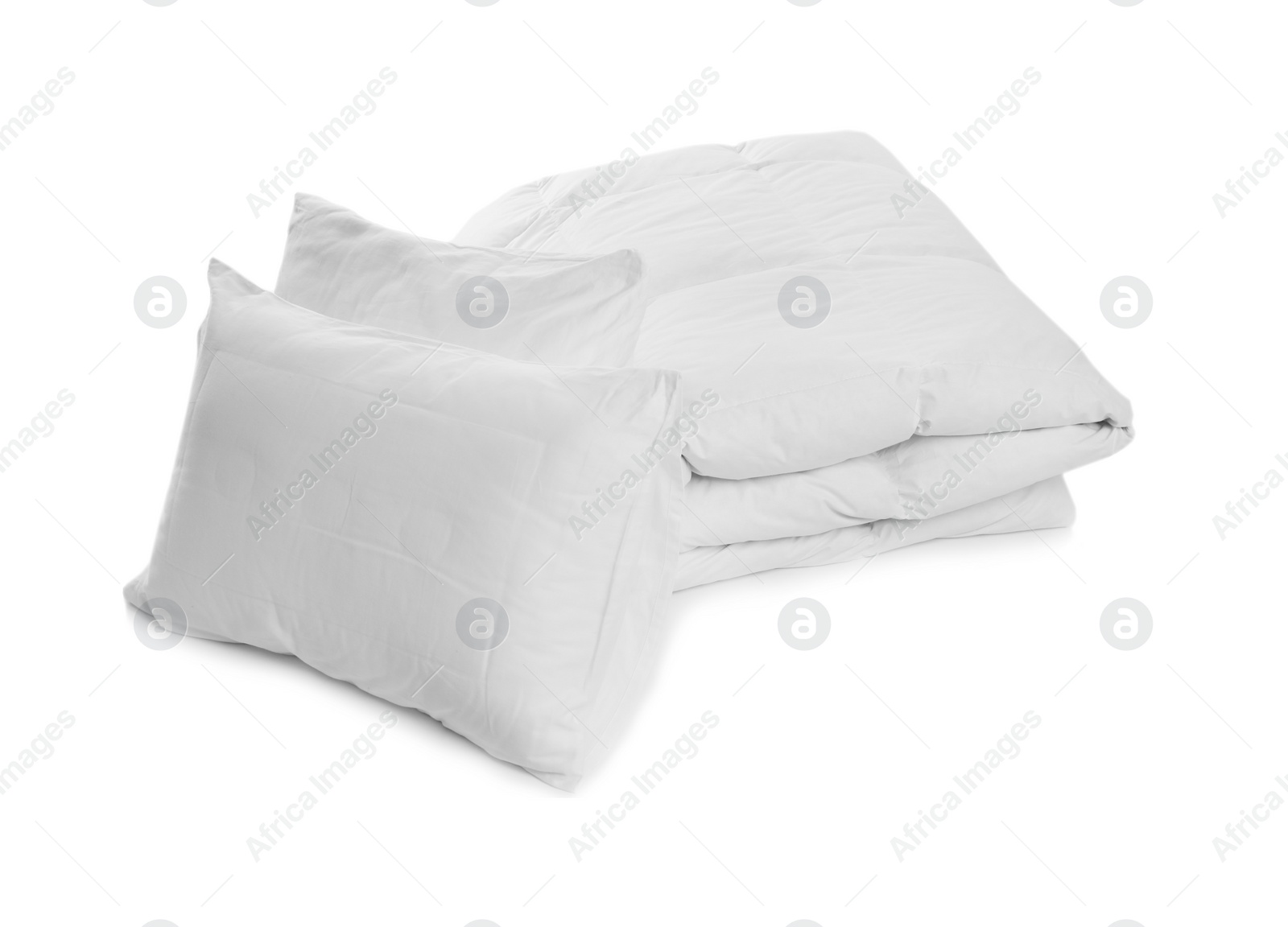 Photo of Clean blanket and pillows on white background