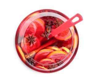 Photo of Glass bowl of delicious aromatic punch drink with ladle on white background, top view