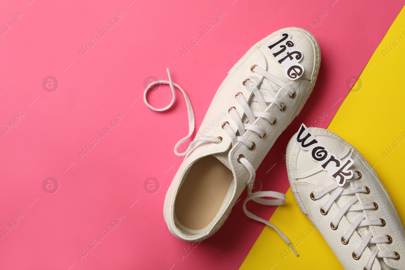 Photo of Stylish shoes on color background, flat lay with space for text. Life work balance concept