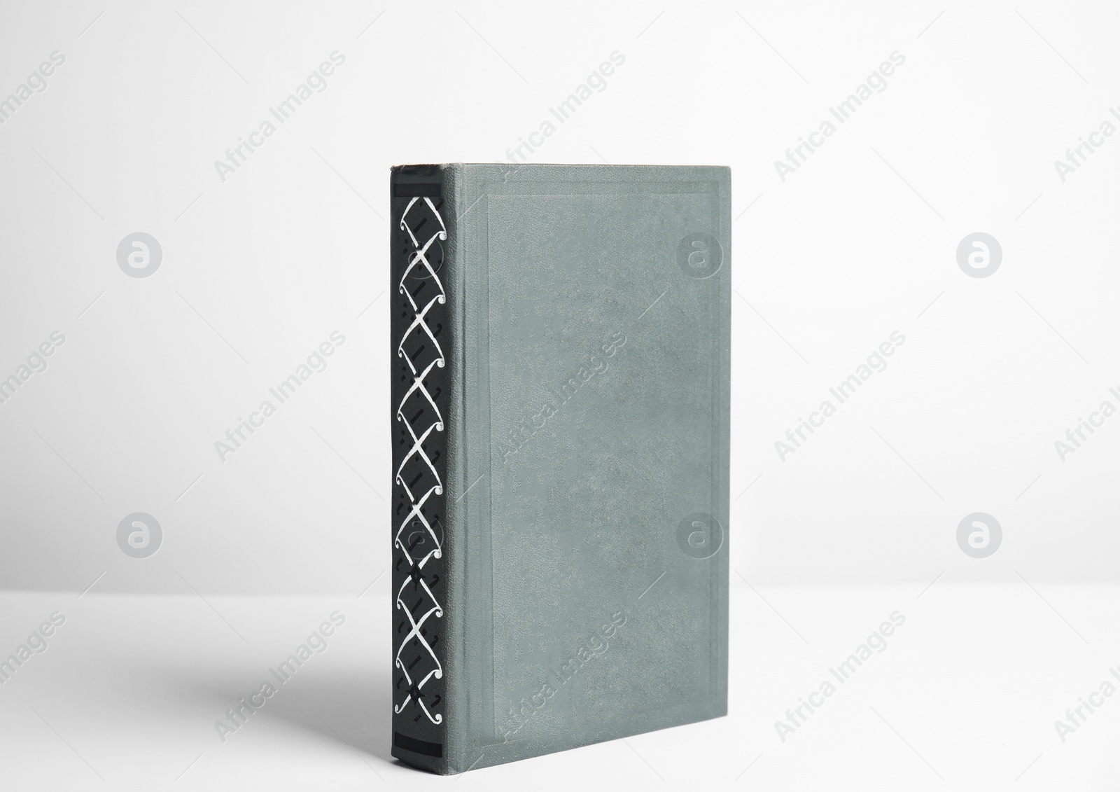 Photo of Hardcover book on white background. Space for design