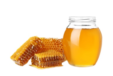 Photo of Jar of honey and pieces of fresh combs on white background