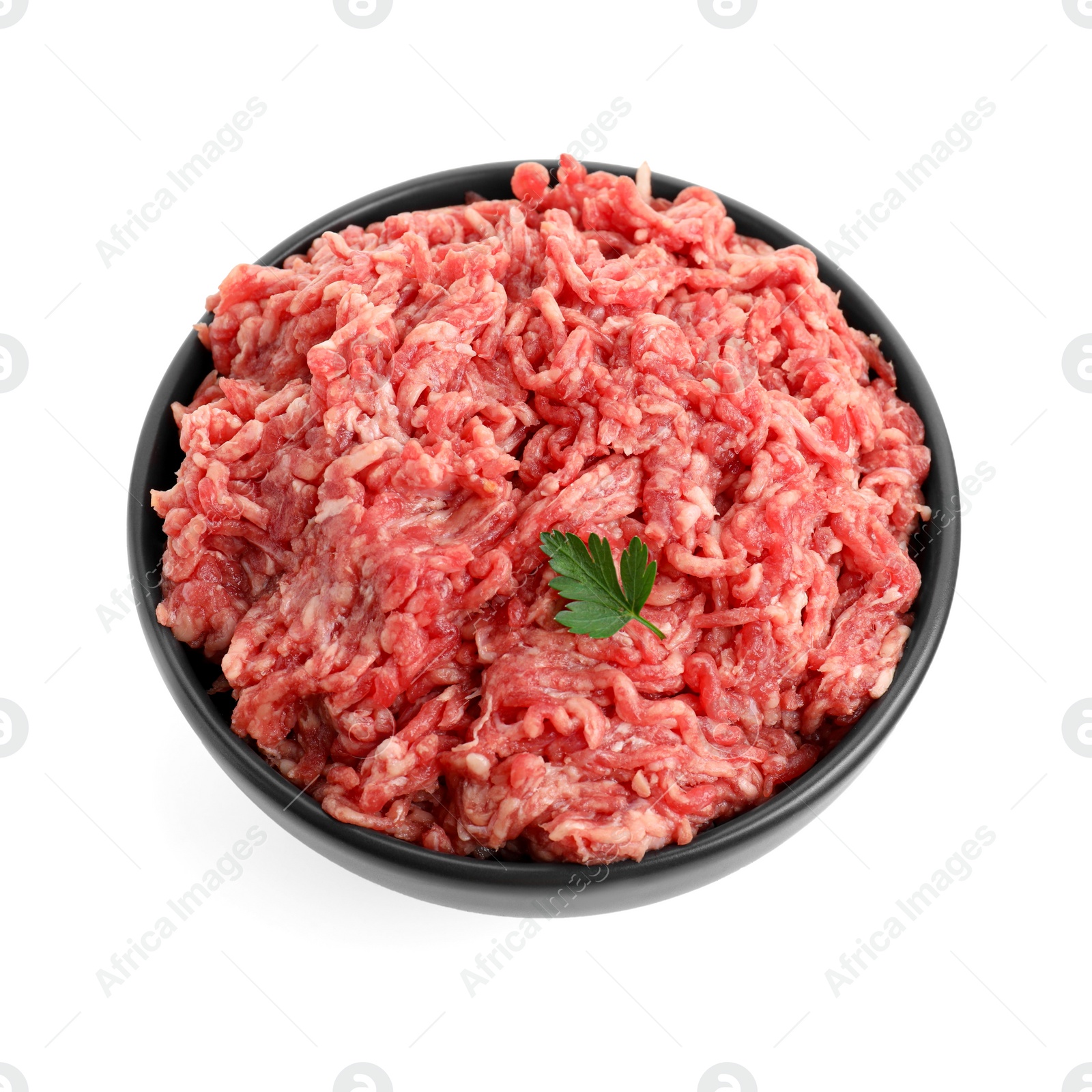 Photo of Raw ground meat and parsley in bowl isolated on white, top view