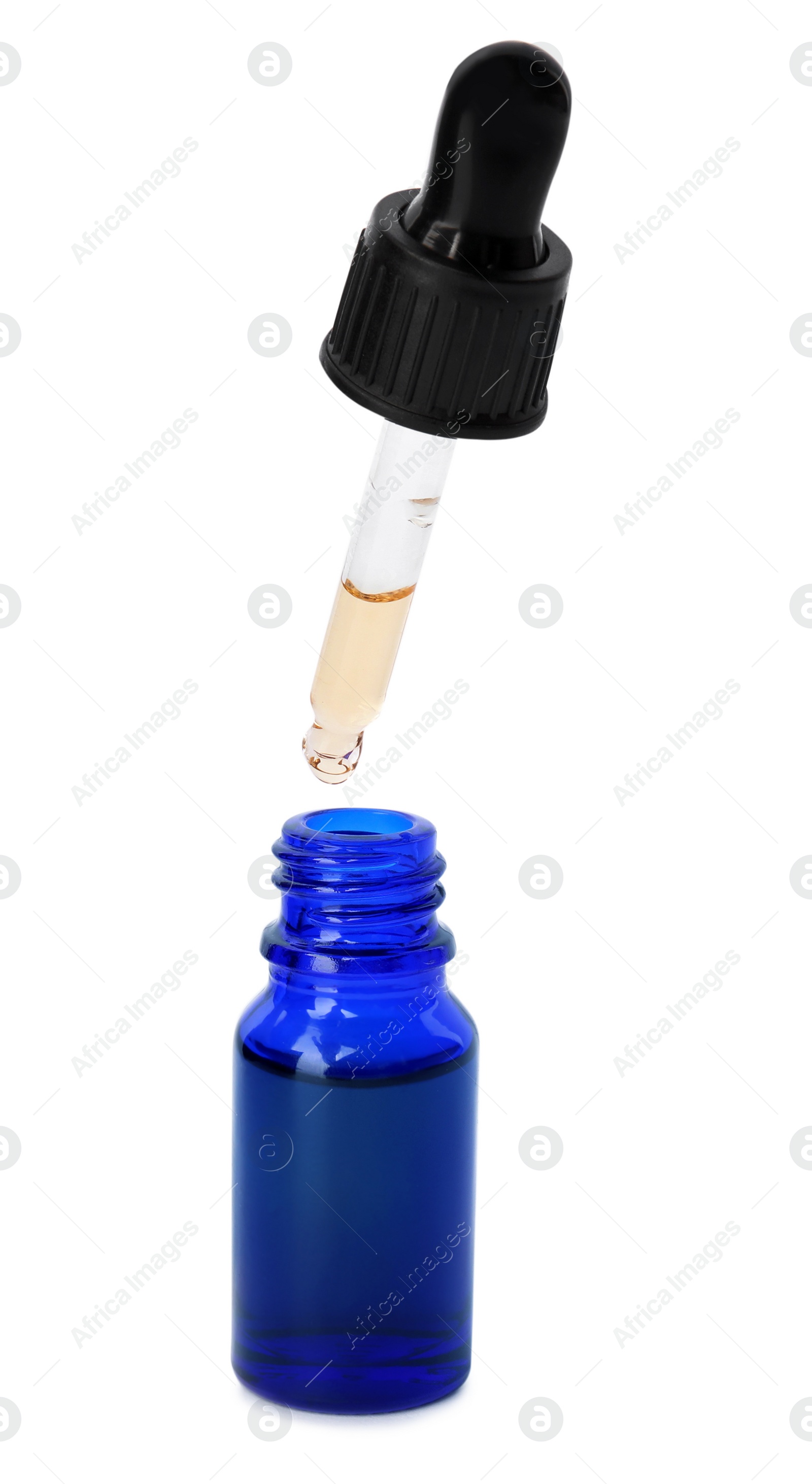 Photo of Blue bottle and dropper with essential oil on white background