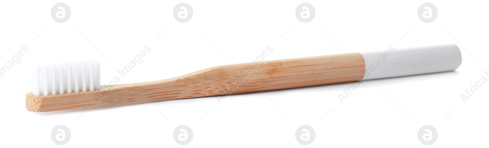 Photo of Bamboo toothbrush on white background. Dental care