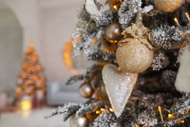 Photo of Beautiful Christmas tree in decorated living room interior, closeup