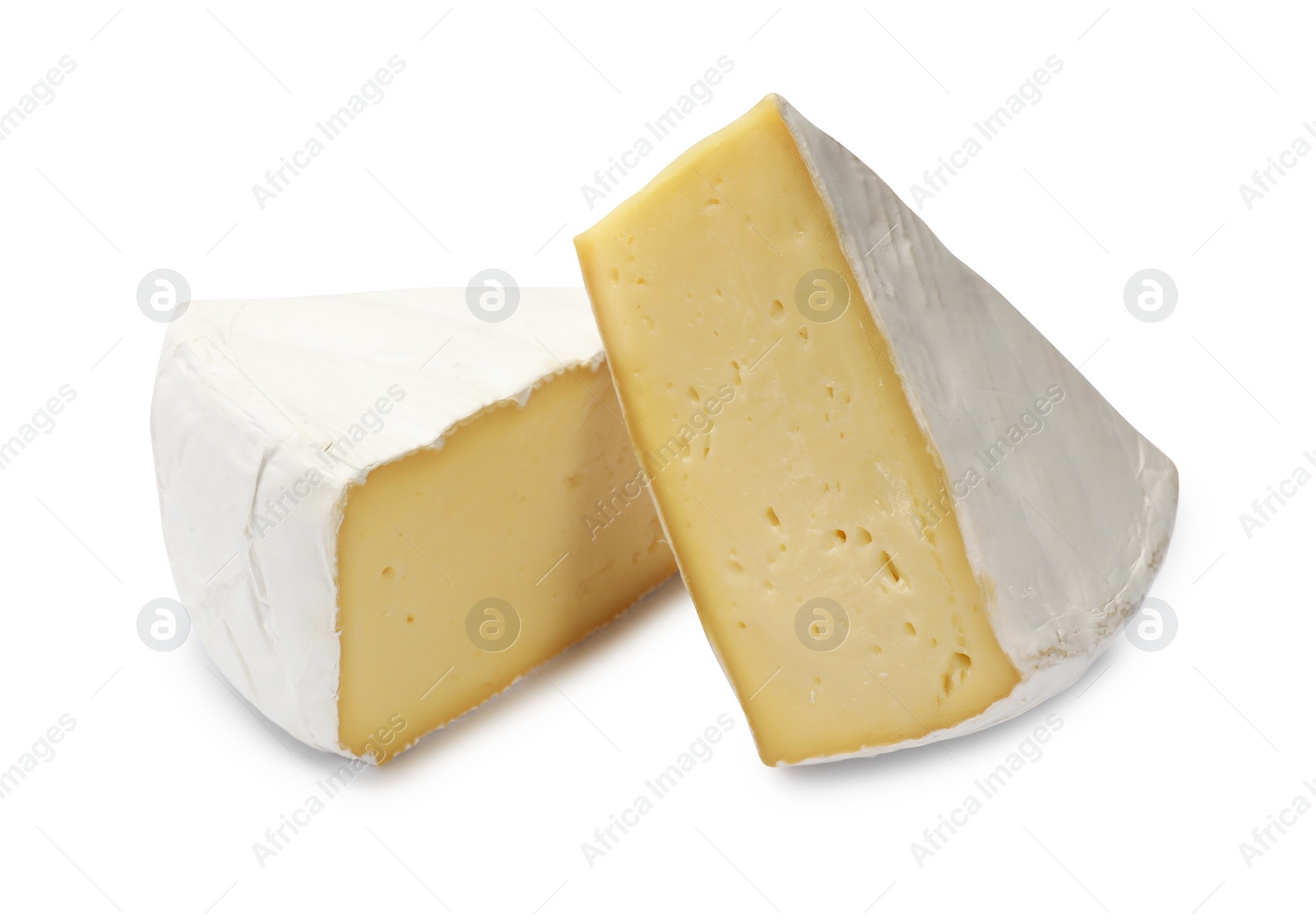 Photo of Pieces of tasty camembert cheese isolated on white