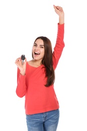 Photo of Happy young woman with car key on white background. Getting driving license