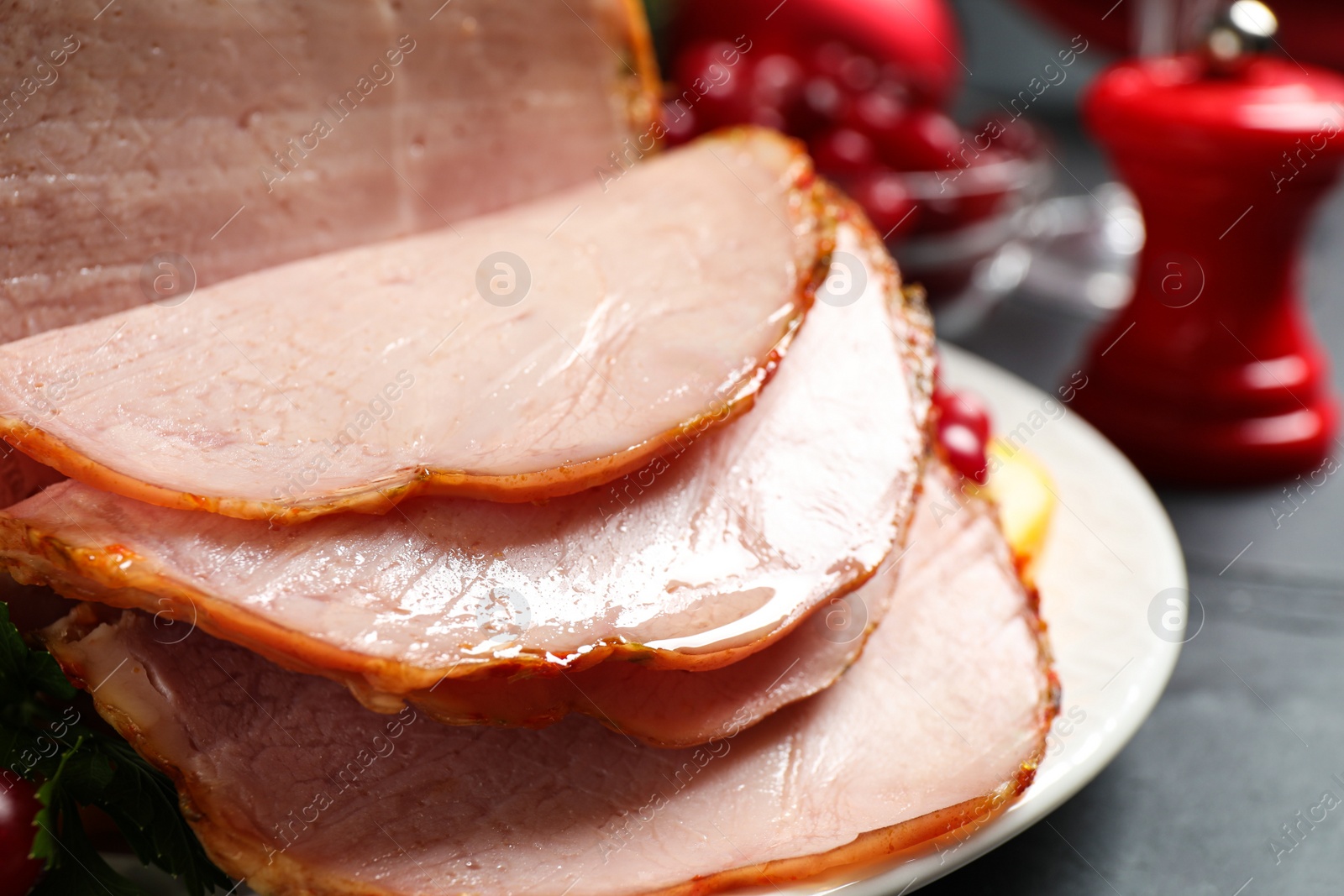 Photo of Slices of delicious cooked ham on table, closeup