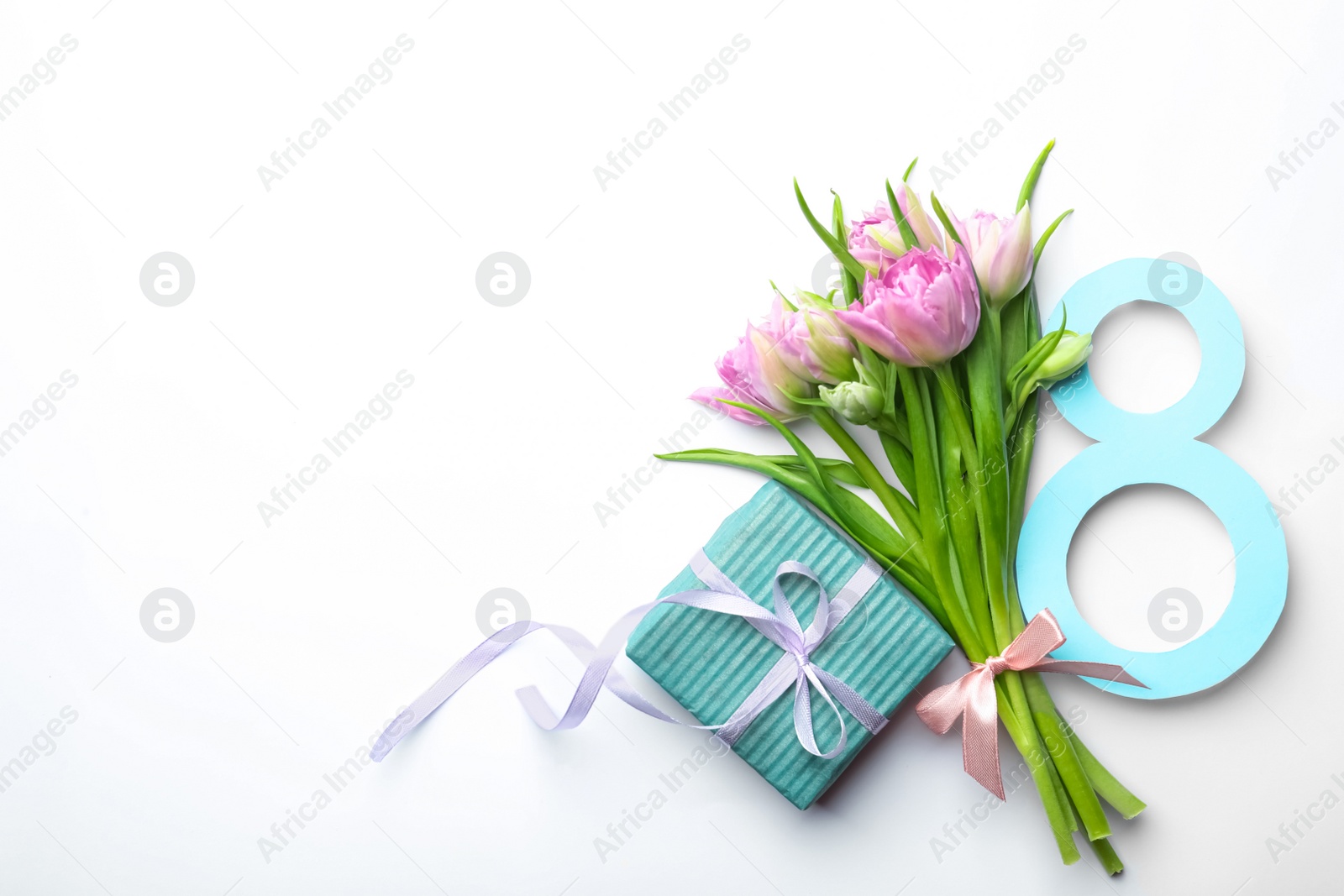 Photo of 8 March greeting card design with tulips and gift on white background, top view. Space for text