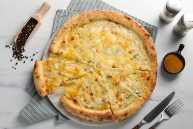 Photo of Delicious cheese pizza served on white marble table, flat lay