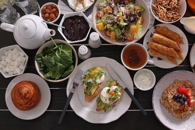 Many different dishes served on buffet table for brunch, flat lay
