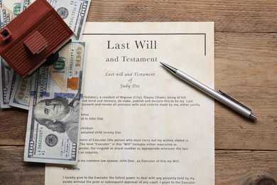 Photo of Last Will and Testament, house model, pen and dollar bills on wooden table, flat lay