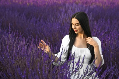 Portrait of beautiful young woman in lavender field