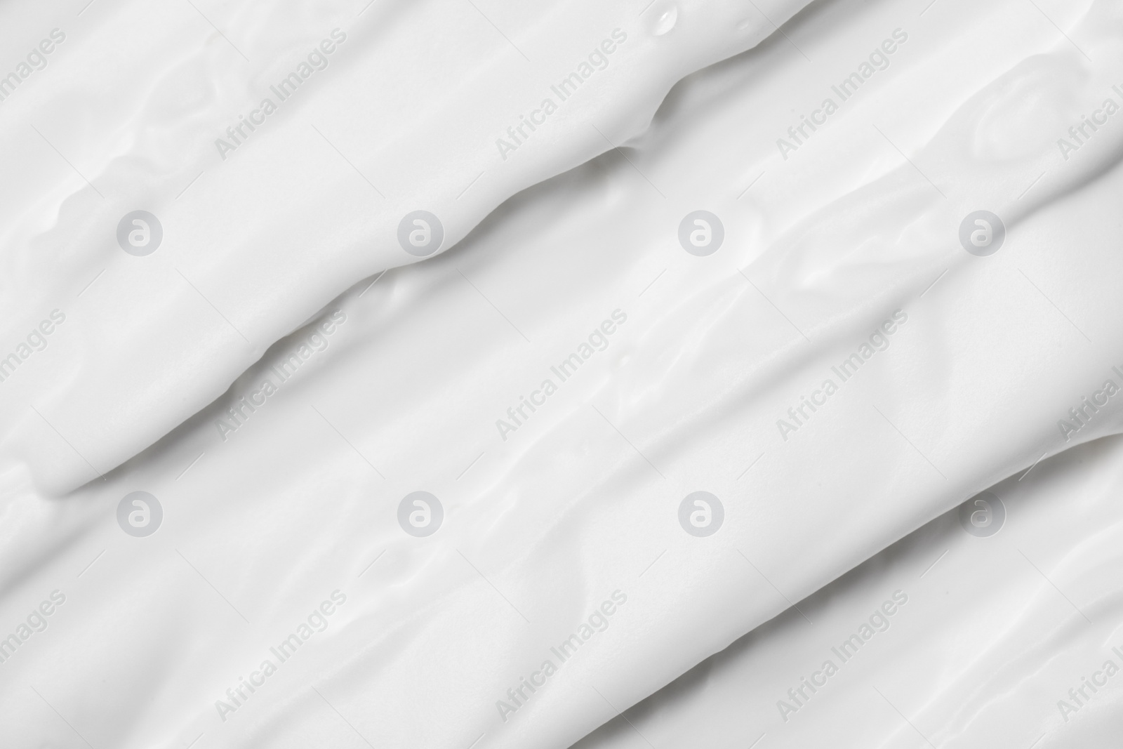 Photo of Texture of white shaving foam as background, top view