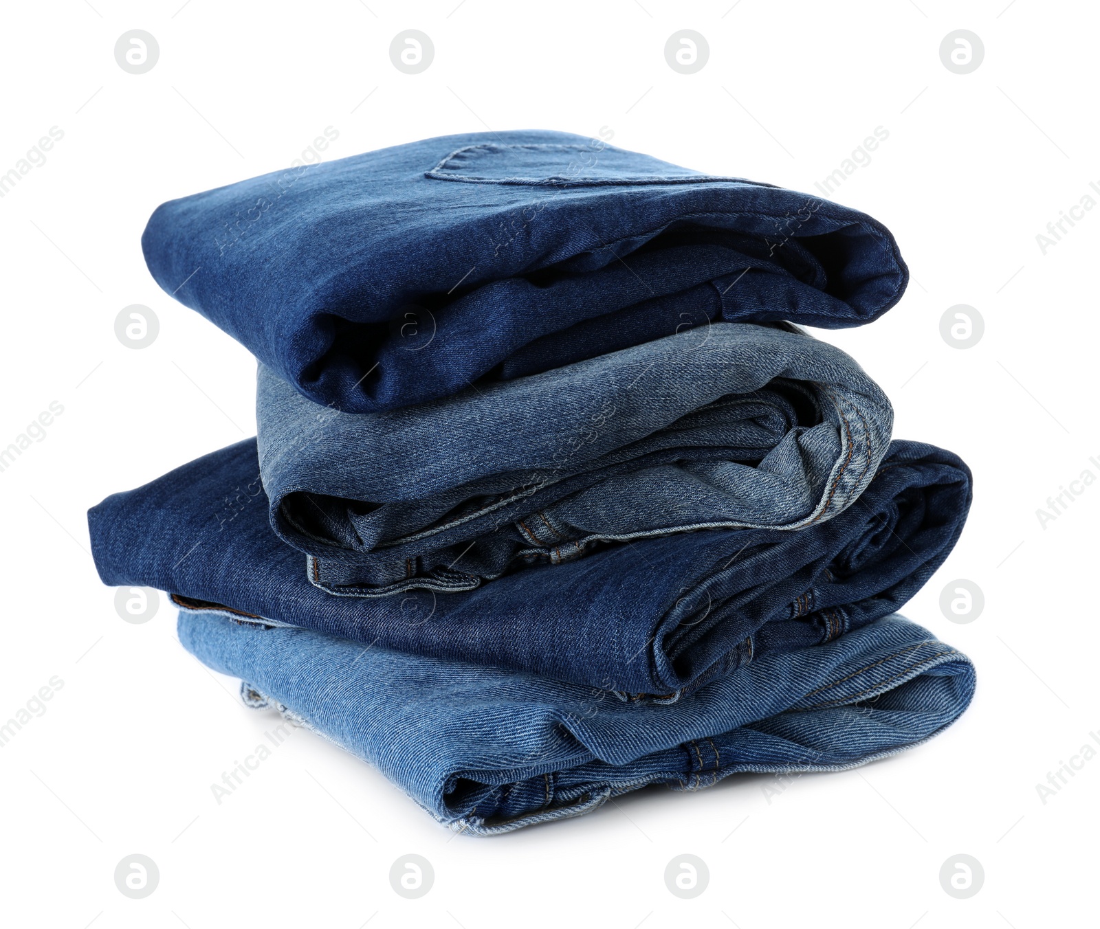 Photo of Stack of different jeans isolated on white