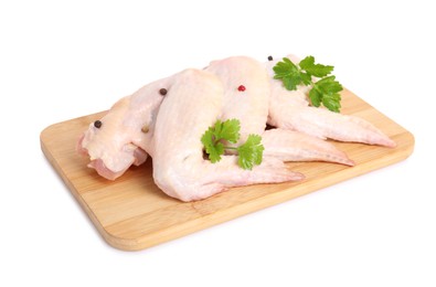 Photo of Raw chicken wings with spices and parsley on white background