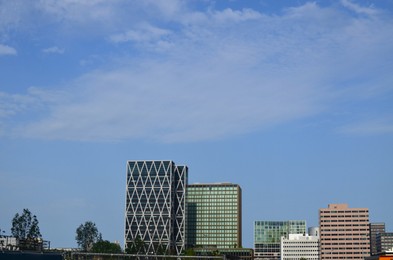 Exterior of beautiful modern skyscrapers against blue sky