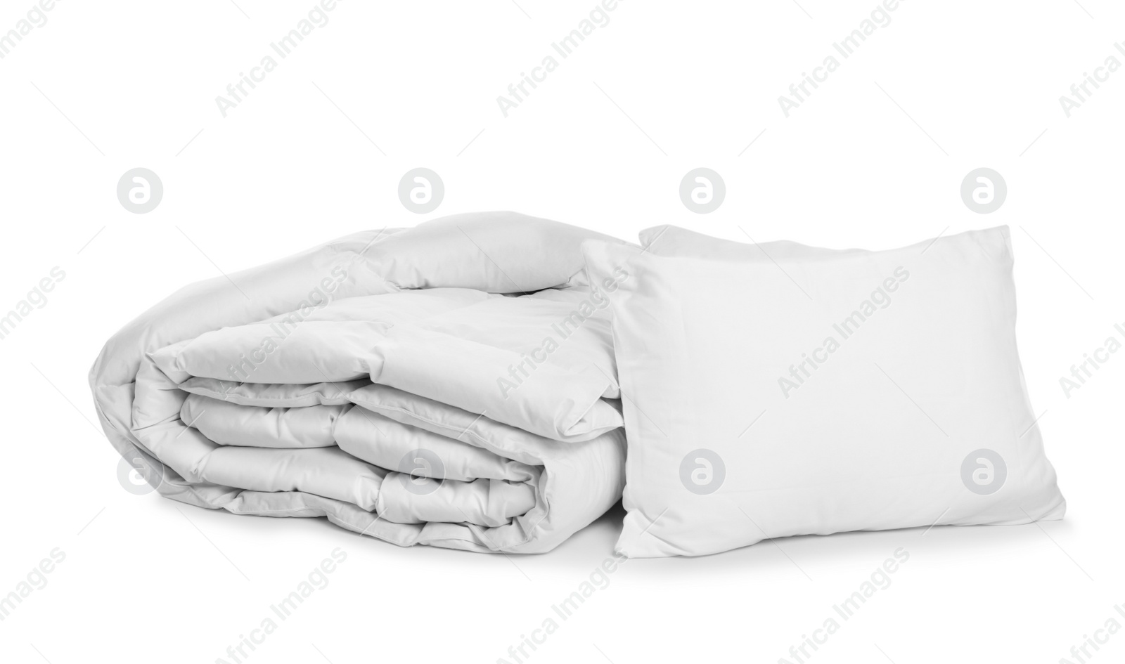 Photo of Clean blanket and pillows on white background