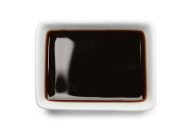 Photo of Dish of soy sauce on white background, top view