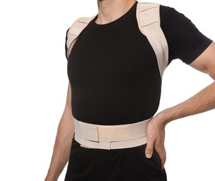 Photo of Closeup view of man with orthopedic corset on white background