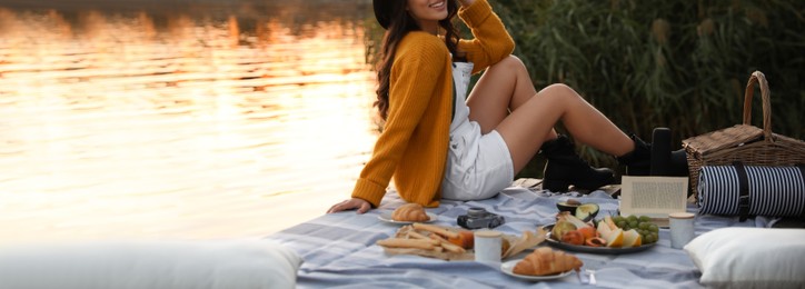 Young woman spending time on pier at picnic, closeup view with space for text. Banner design