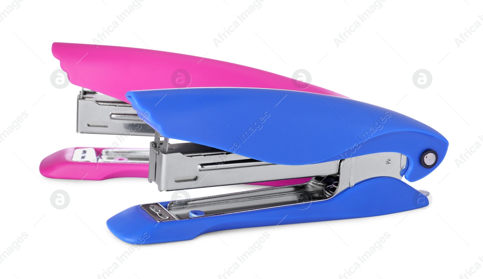 Photo of New bright color staplers isolated on white