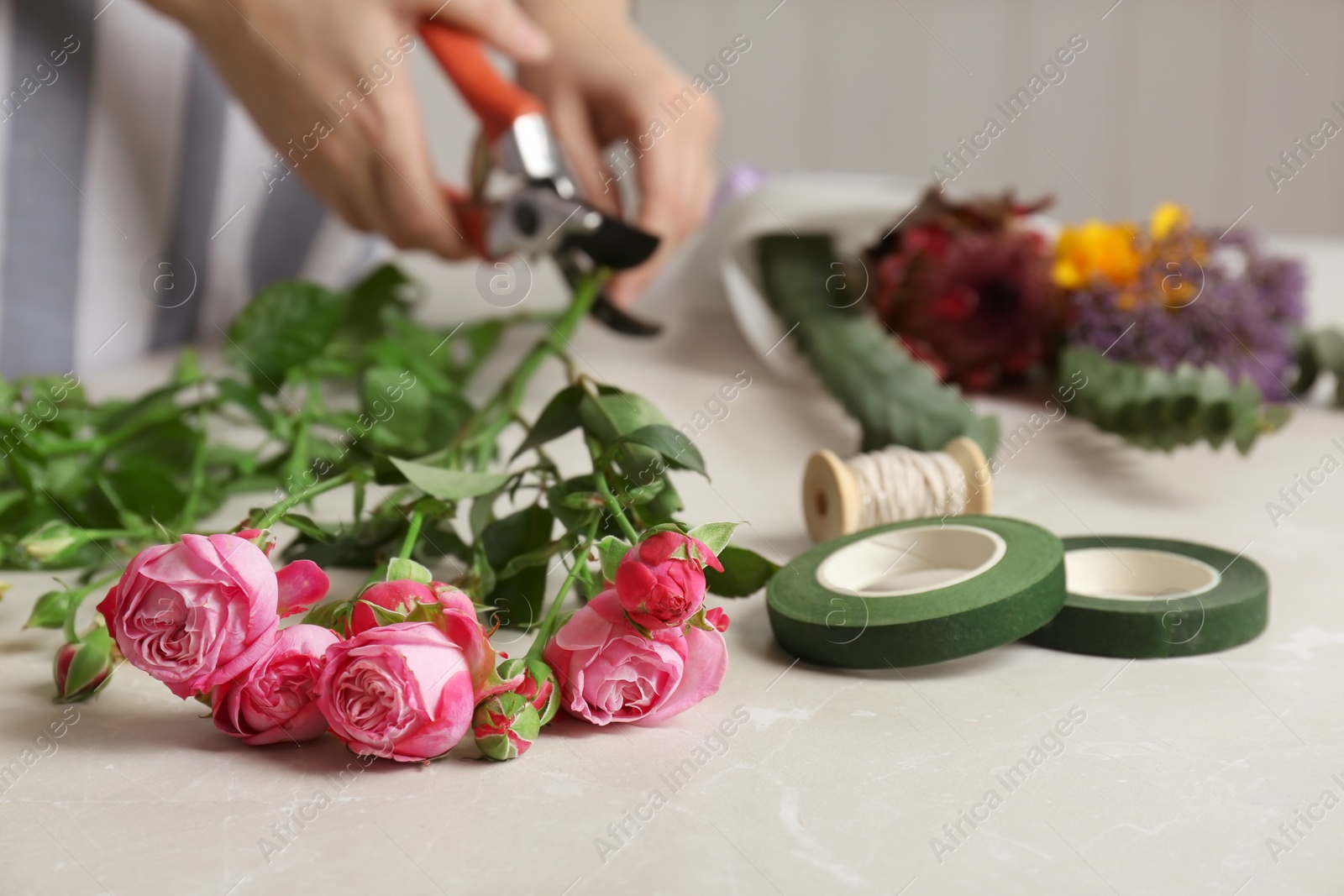 Photo of Beautiful bouquet and blurred florist on background