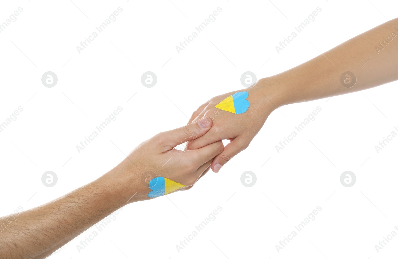 Photo of Man and woman with painted Ukrainian flags on their hands against white background, closeup